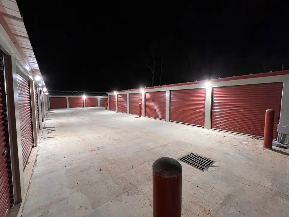 Well-lit storage facility at night in Willis, TX